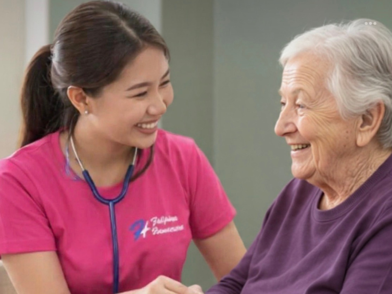 Filipino nurse caring for a senior patient at home